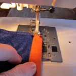 turn over a half inch to back and stitch as shown