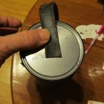 use hot glue to attach the strap to bottom of can