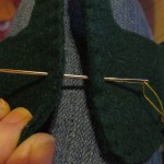 use a big darning needle to pull the gold cord through